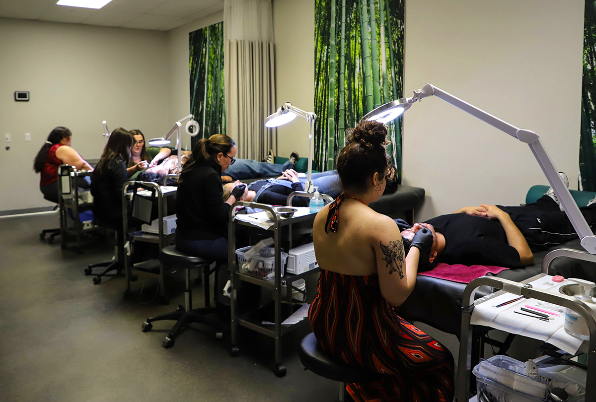 Oliver Finley Academy students in the esthetics open classroom performing services
